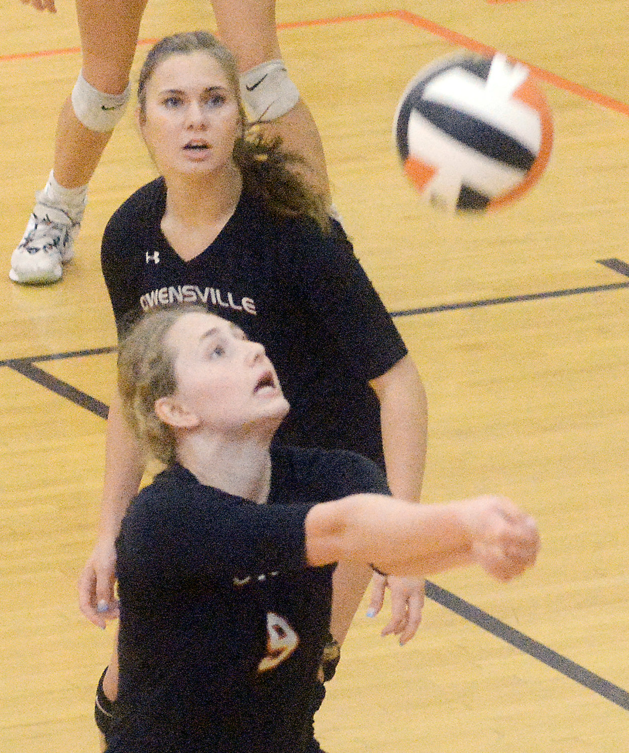 Elise McFalls lunges for the volleyball with JV Dutchgirl volleyball teammate Brynn Wright also looking on during action last Wednesday night at Owensville High School against Washington.